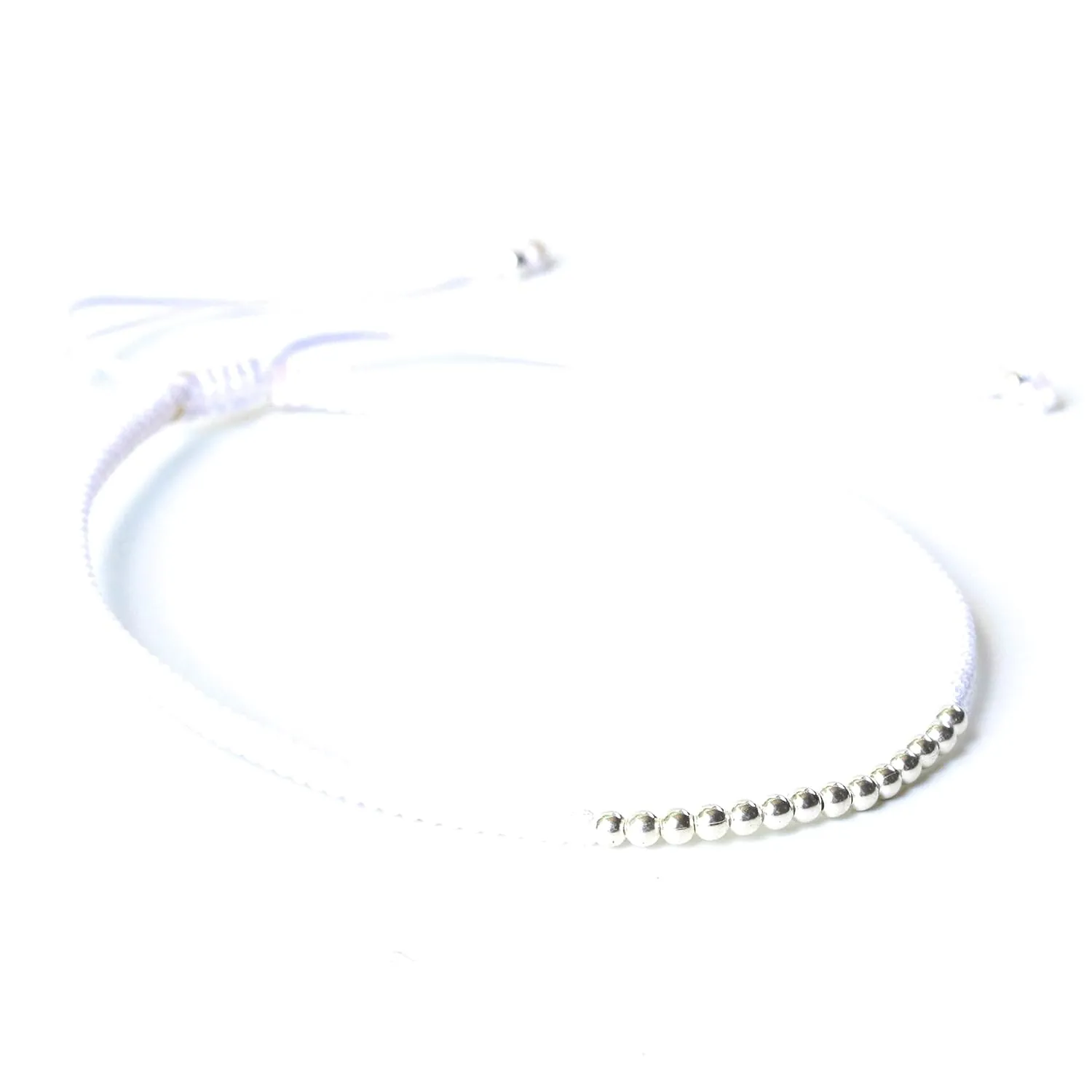 Adjustable friendship bracelet in cotton string and sterling silver beads at the center(White)